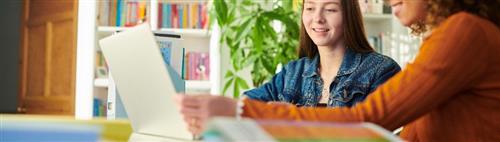 mother helping daughter with homework